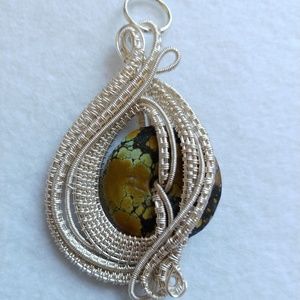 Chinese vintage turquoise wrapped in a silver wire